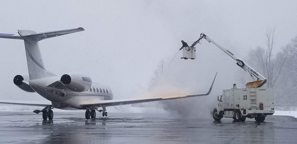 Airplane being sprayed with deicing fluid