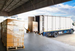 Freight that has been consolidated being loaded onto a truck