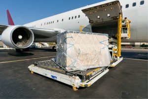 Air freight on loading platform to airplane