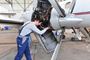 Airplane inspection perfomed by mechanic