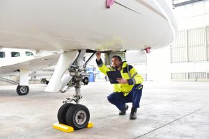 MRO check being performed by an airplane mechanic