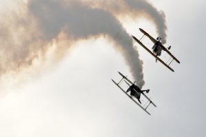 Stunt airplanes performing aerobatic maneuvers in the air